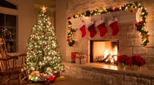Christmas tree in front of fireplace with stockings
