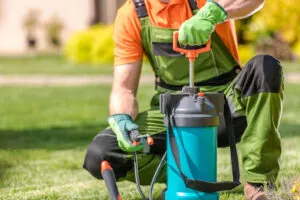 Fort Myers pest control expert kneeling in grass