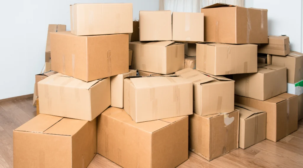 a stack of cardboard boxes in a room
