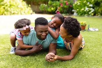 happy family in Port St. Lucie laying their yard after a pest control service