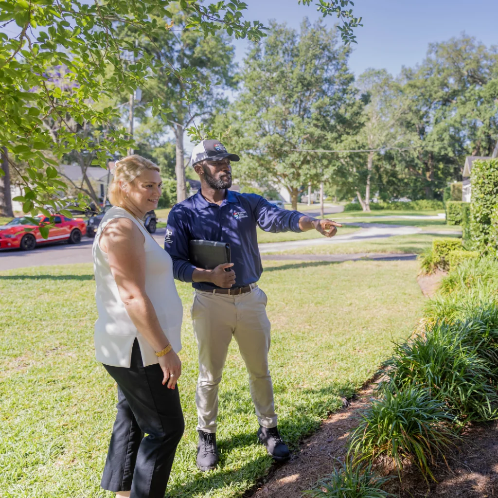 Gainesville exterminator talking with customer